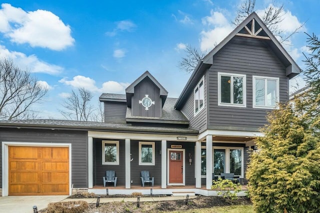 view of front of house with a garage and a porch