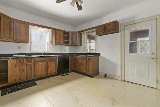 kitchen with black dishwasher, sink, and ceiling fan