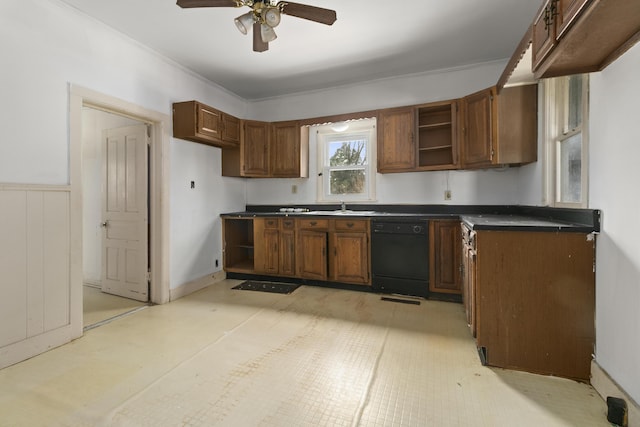 kitchen featuring ceiling fan, black dishwasher, and sink