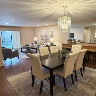 dining area featuring a chandelier and dark hardwood / wood-style floors