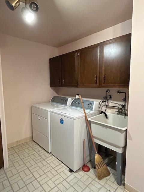 laundry area with cabinets and independent washer and dryer