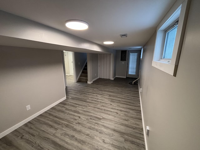 basement featuring dark hardwood / wood-style floors