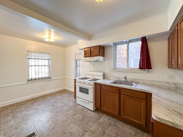 kitchen featuring gas range gas stove and sink