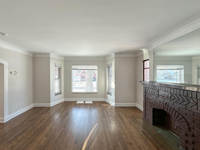 unfurnished living room featuring a brick fireplace, dark hardwood / wood-style flooring, and crown molding