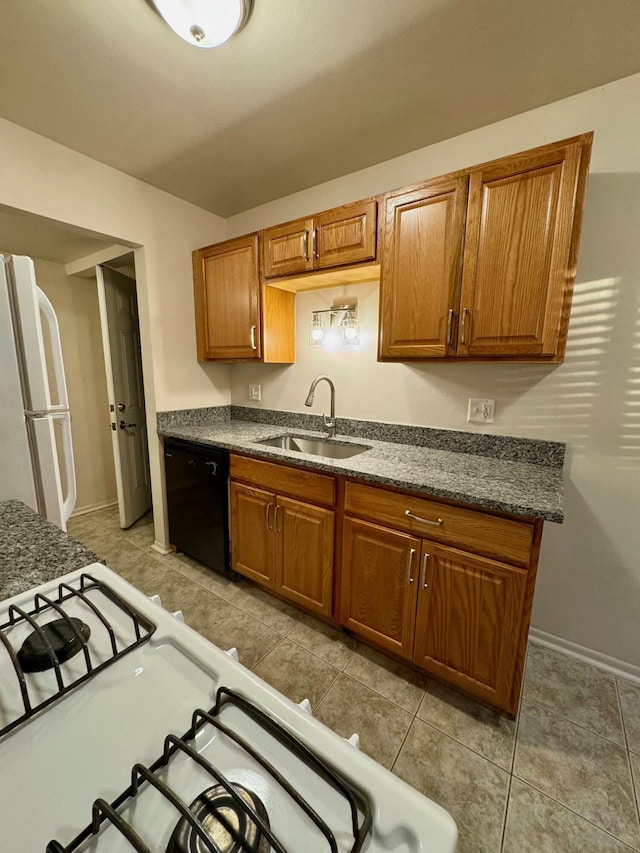 kitchen with white appliances, light tile patterned flooring, and sink