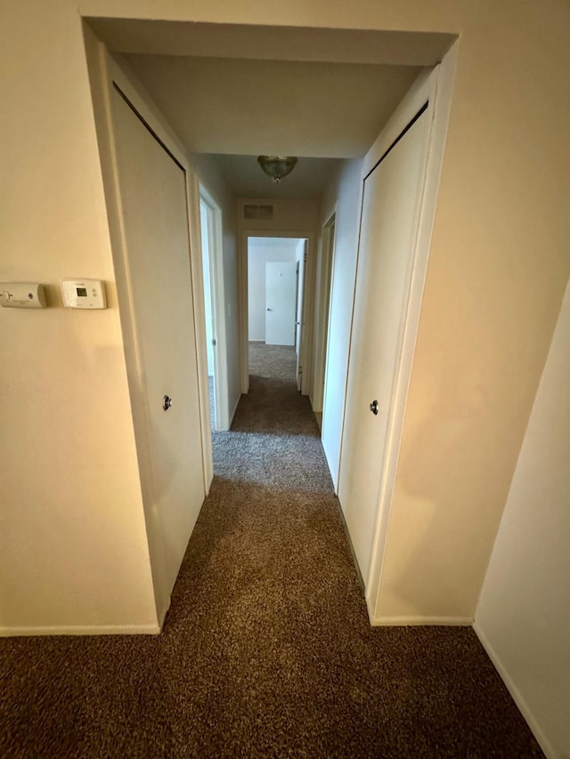 hallway with carpet