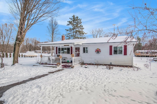 ranch-style house with covered porch