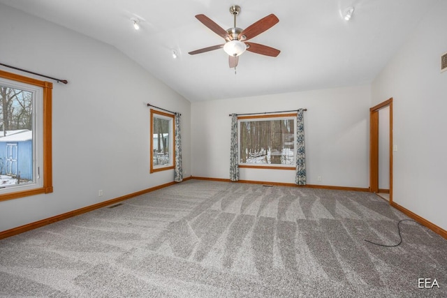 unfurnished room with ceiling fan, carpet floors, and vaulted ceiling