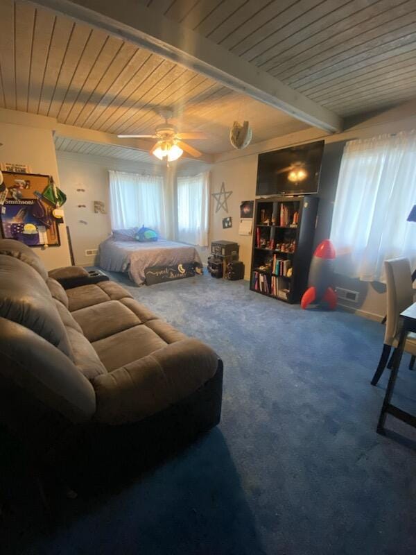 carpeted living room featuring beam ceiling, ceiling fan, and wooden ceiling