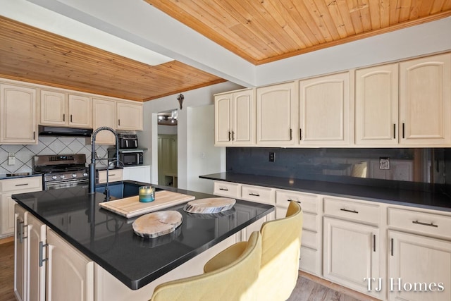 kitchen with wood ceiling, tasteful backsplash, ventilation hood, stainless steel range, and light hardwood / wood-style floors