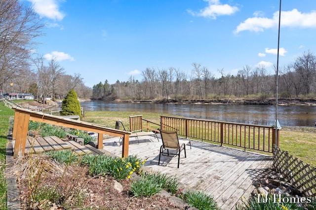 wooden deck featuring a water view