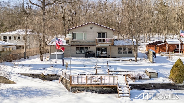 view of snow covered house