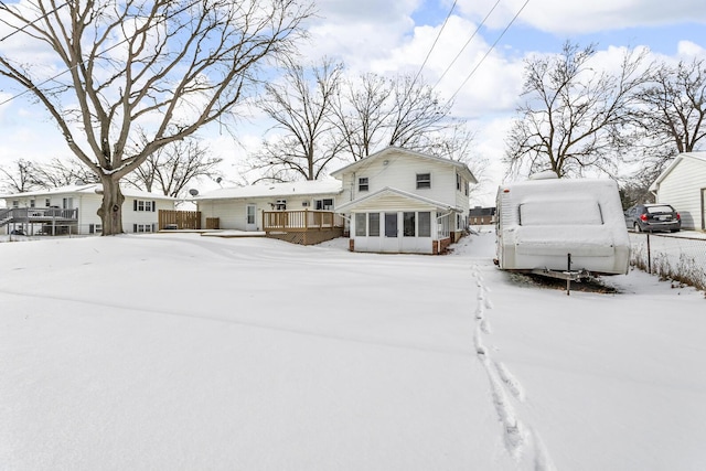 view of front of house with a deck and a sunroom