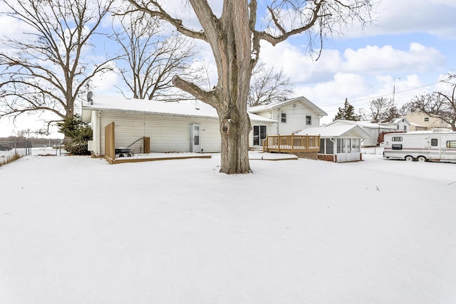 view of yard layered in snow