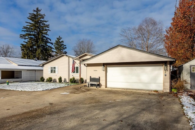 view of front facade with an outbuilding and a garage