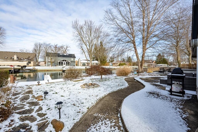 view of yard layered in snow