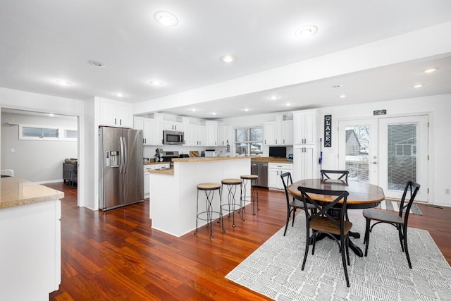 dining room with dark wood-type flooring