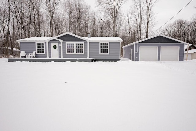 view of front of home featuring a garage and an outdoor structure