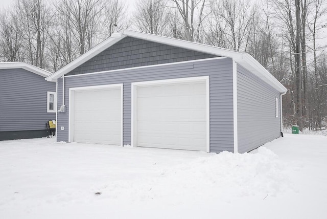 view of snow covered garage