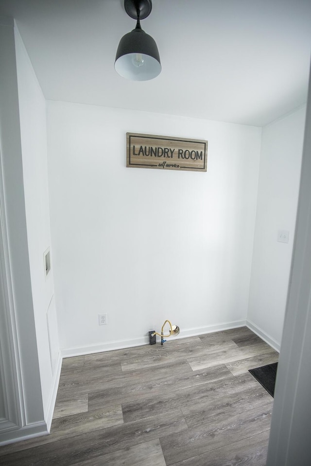 washroom with wood-type flooring