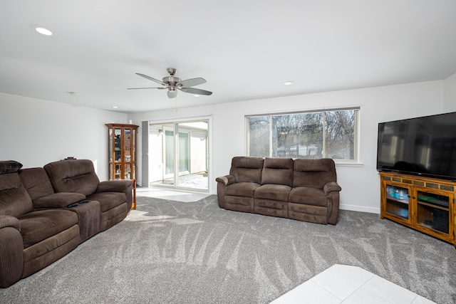 living room featuring ceiling fan and carpet flooring