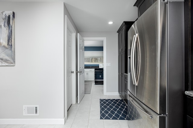 kitchen with white cabinetry, wine cooler, light tile patterned floors, and stainless steel fridge