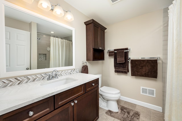 bathroom with vanity, walk in shower, and toilet