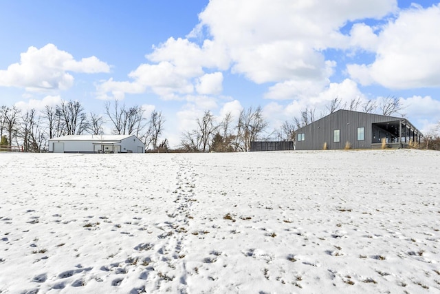 view of yard layered in snow