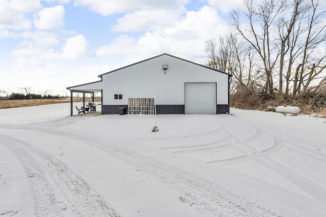 view of snow covered garage