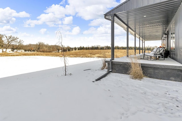 view of yard covered in snow