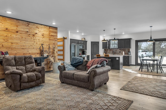 living room with light hardwood / wood-style flooring