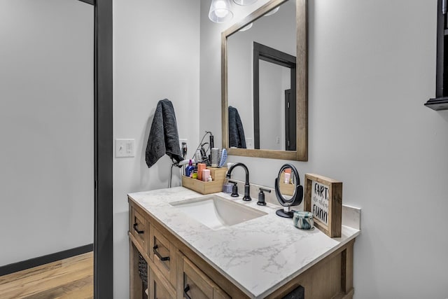 bathroom featuring vanity and wood-type flooring