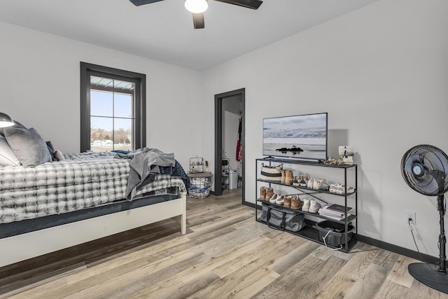 bedroom featuring light hardwood / wood-style floors and ceiling fan