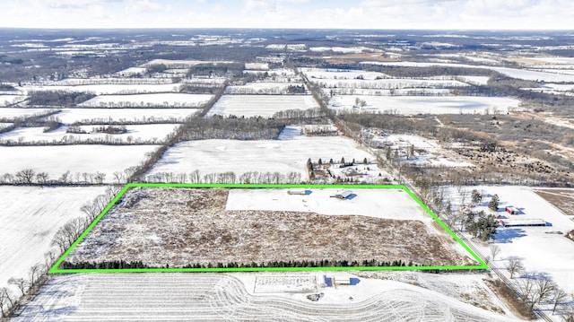 snowy aerial view with a rural view