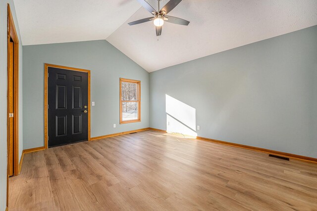 entrance foyer featuring vaulted ceiling, ceiling fan, and light hardwood / wood-style floors