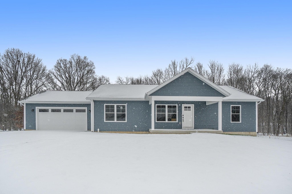 ranch-style house featuring a garage