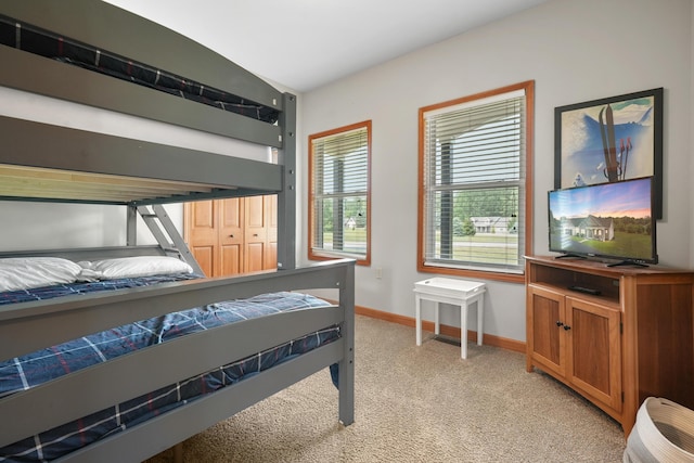 carpeted bedroom with a closet