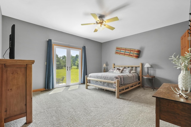 bedroom with ceiling fan, french doors, and light carpet