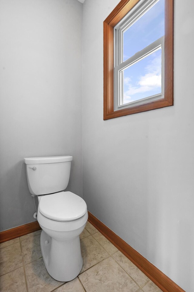 bathroom with tile patterned floors and toilet