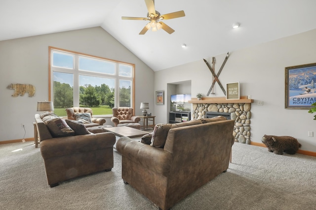 carpeted living room with ceiling fan, high vaulted ceiling, and a fireplace