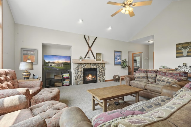 carpeted living room featuring high vaulted ceiling, ceiling fan, and a stone fireplace