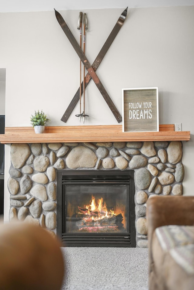 details with a stone fireplace