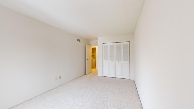 unfurnished bedroom featuring a closet