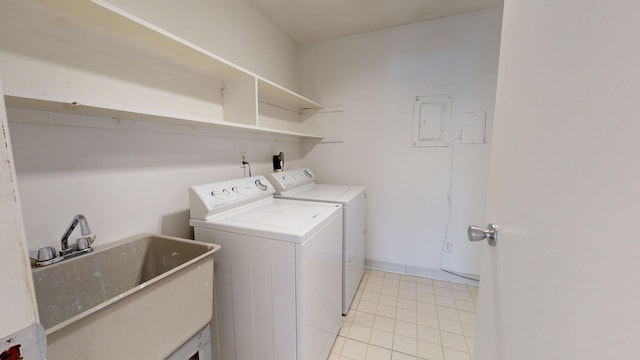 laundry area featuring sink, separate washer and dryer, and electric panel