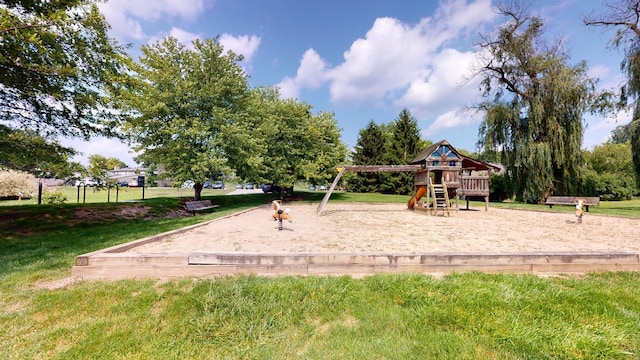 view of jungle gym featuring a lawn