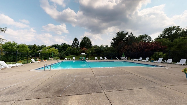 view of swimming pool featuring a patio area