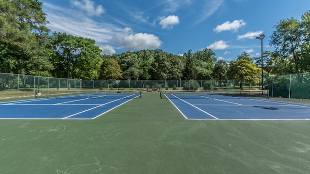 view of sport court with basketball hoop