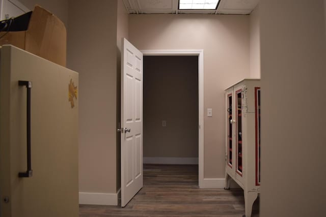 corridor featuring dark hardwood / wood-style floors