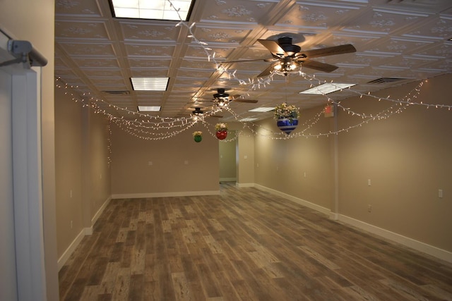 unfurnished room featuring ceiling fan and hardwood / wood-style floors