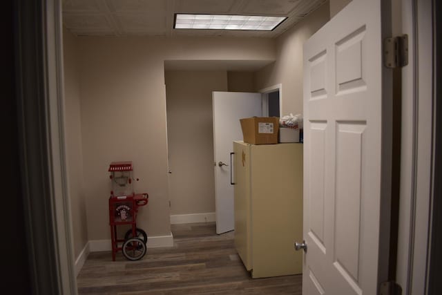 hallway with dark hardwood / wood-style flooring